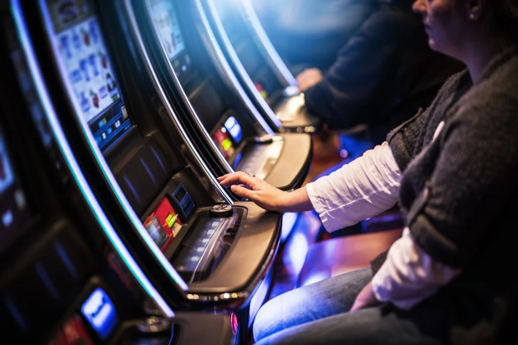 Players at gaming machines in action.